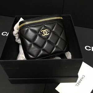 CHANEL Black Quilted Leather Mini Pouch with Gold Hardware